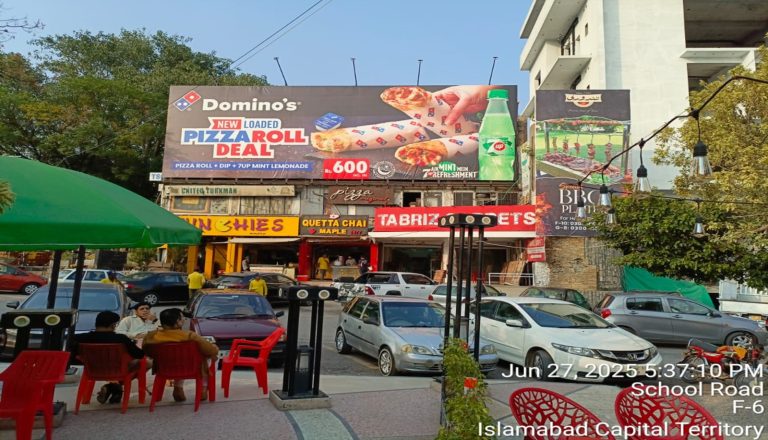 Hadi Communication’s outdoor advertising billboards installed at a busy commercial location on School Road, F-6 Islamabad, featuring Domino’s and local food brands—expertise in billboard and branding solutions across Islamabad and Rawalpindi.